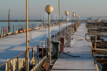 Deserted Pier in a Sunny Winter Day