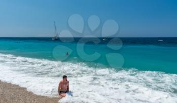 Dhermi, Albania - 07.08.2018. People relaxing in the resort Dhermi in Albania on a sunny summer day