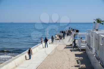 Odessa, Ukraine - 04.22.2019. Beach and pier in Arcadia resort in Odessa, Ukraine on a sunny spring day