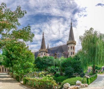 Ravadinovo, Bulgaria – 07.11.2019.  View of the Ravadinovo castle from the main entrance to the park in the village of Ravadinovo, Bulgaria, on a sunny summer day