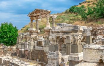 Ruins of The Fountain of Trajan in antique Ephesus city on a sunny summer day