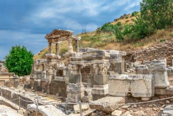 Ruins of The Fountain of Trajan in antique Ephesus city on a sunny summer day