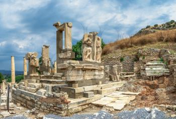 The Ruins of The Polyphemus statues of Pollio Fountain in antique Ephesus city, Turkey, on a sunny summer day