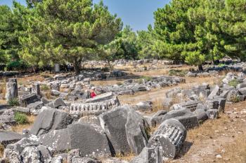 Ruins of the Ancient Theatre in the greek city of Priene in Turkey on a sunny summer day