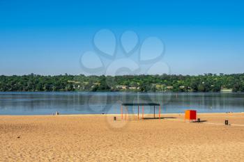Zaporozhye, Ukraine 07.21.2020. Public beach on the banks of the Dnieper in Zaporozhye, Ukraine, on a sunny summer morning
