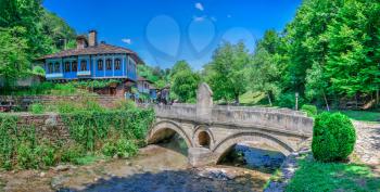 Gabrovo, Etar, Bulgaria - 07.27.2019. Stone bridge in the Etar Architectural Ethnographic Complex in Bulgaria on a sunny summer day. Big size panoramic photo.