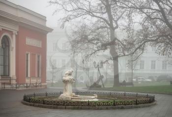 Odessa, Ukraine 11.28.2019.  Sculpture on Teatralnaya Square in Odessa, Ukraine, on a foggy autumn day