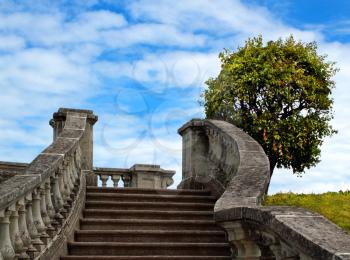 The old stone stairway over the blue sky