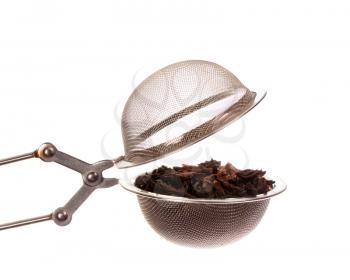 Black tea in strainer isolated on white background