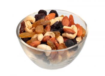 Dry fruits and nuts in glass plate isolated on white background