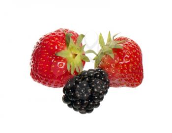 Blackberry and two strawberries isolated on white background