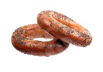 Two poppyseed bagels isolated on white background