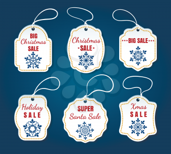 Christmas sale tags isolated on blue background. Vector white xmas special offer badges