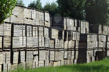 Wooden boxes stacked together. Warehouse empty wooden containers.