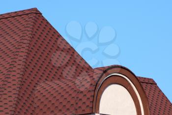 Decorative metal tile on a roof. Types of a roof of roofs.