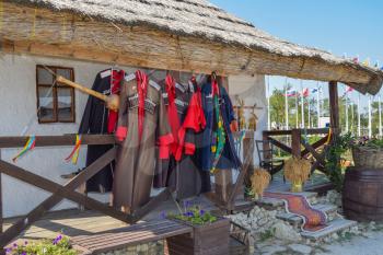 Russia, Ataman - 26 September 2015: Cossack upper uniforms hanging on the veranda. Drying Cossack form.