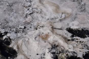 The crust of salt on the bottom of the curative mud dry lake. The surface of the salt lake.