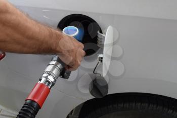 Filling with car gasoline. Service on a gas station.