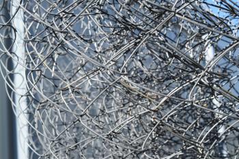 Background of folded mesh netting. Grey mesh netting.