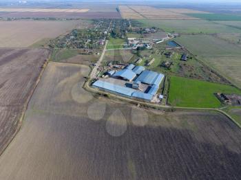 Top view of the village with houses and hangars for the storage of grain.