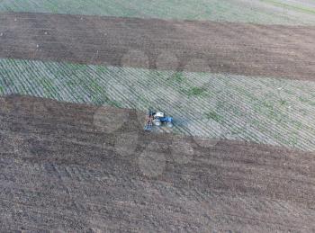 Top view of the tractor that plows the field. disking the soil. Soil cultivation after harvest.