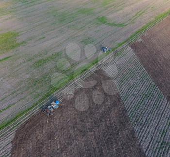 Top view of the tractor that plows the field. disking the soil. Soil cultivation after harvest.