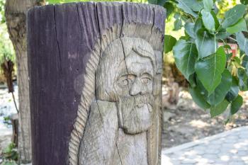 Wooden idol. Woodcarving. Decoration of the park in the form of statues, idols made of wood.