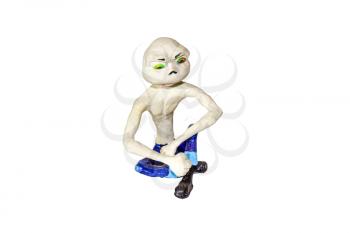 Umorik in sitting posture. Figurine of a skinny character with a large head. Molded from clay and clay.