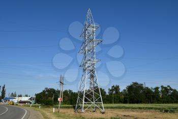Power line support, insulators and wires. Appearance of a design. Assembly and installation of new support and wires of a power line.