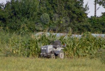 Tractor on a private farm. Farming equipment.