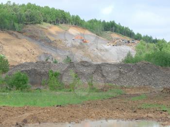 Excavation of a pit. Production of gray crushed stone for road powder.
