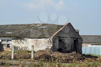 Abandoned cow farm. The ruins of the Soviet collective farms.