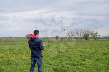 A man with a remote control in his hands. Flight control of the drone. Phantom.