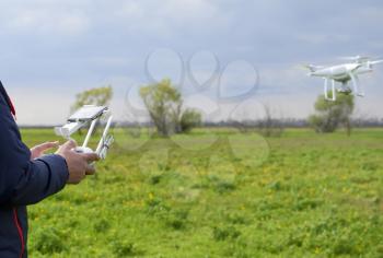 A man with a remote control in his hands. Flight control of the drone. Phantom.