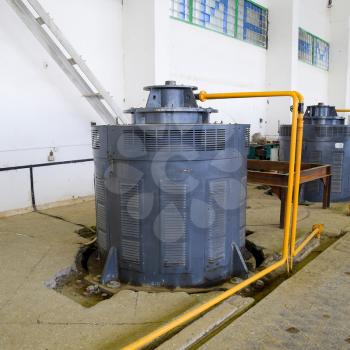Engines of water pumps at a water pumping station. Pumping irrigation system of rice fields. Room control and maintenance of pump electric motors.