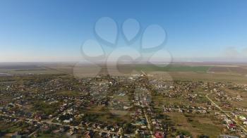 Top view of the village. The village of Poltavskaya. Top view of the village. One can see the roofs of the houses and gardens. Village bird's-eye view.