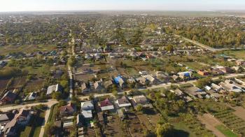 Top view of the village. The village of Poltavskaya. Top view of the village. One can see the roofs of the houses and gardens. Village bird's-eye view.