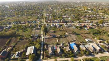 Top view of the village. The village of Poltavskaya. Top view of the village. One can see the roofs of the houses and gardens. Village bird's-eye view.