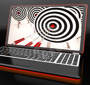 Target Hit On Laptop Showing Perfect Shot Or Precise Aiming