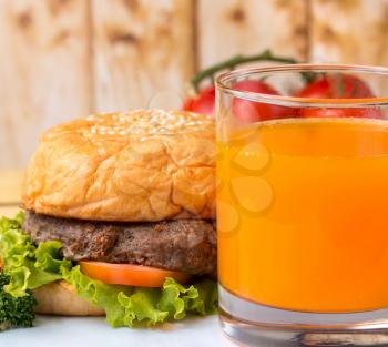 Burger And Juice Representing Orange Drink And Bbq