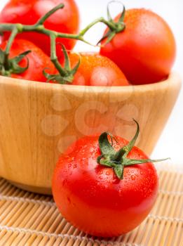 Fresh vine tomatoes in a bowl on a table