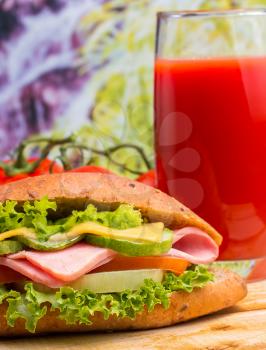 Healthy salad roll and a glass of freshly made tomato juice