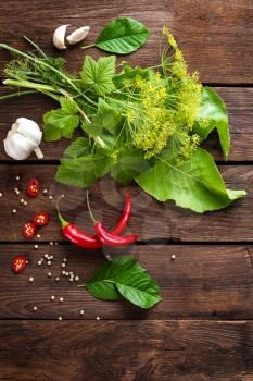 Herbs and spices on wooden culinary background, ingredients for cooking