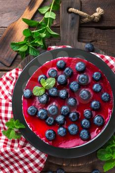 Blueberry cake with fresh berries and marmalade, cheesecake