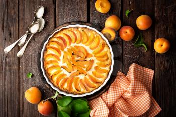 Apricot cake or pie with fresh fruits, cheesecake