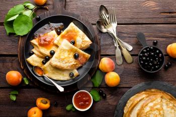 Pancakes with fresh blackcurrant and apricot jam