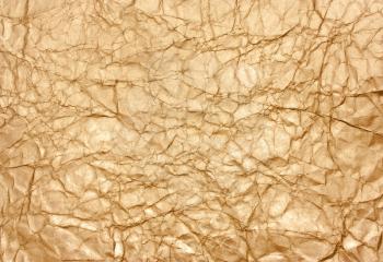 Gold background texture of crumpled paper