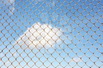 Sky behind the fence. The concept of freedom, security, loneliness, imprisonment,refugee