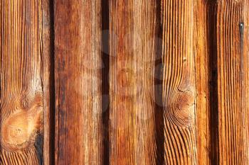 Texture background of old wood boards and shabby yellow, brown paint