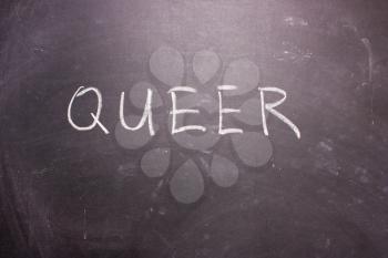 QUEER word chalk on a blackboard, symbol LGBT